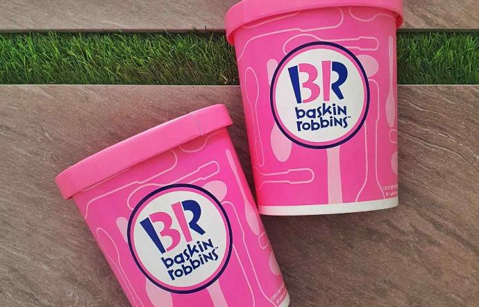Two pink boxes of Baskin-Robbins ice-creams.