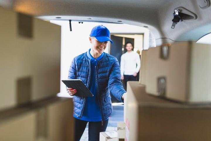 A man with blue cap is counting the stock.